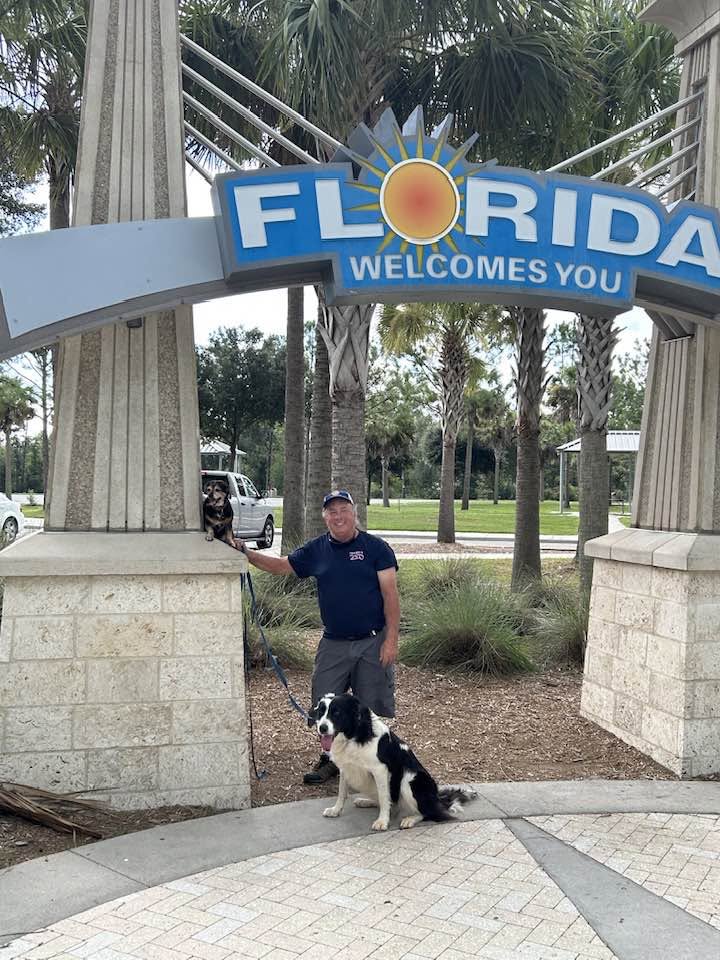 Mark Skowron with Capri and Willow at Florida Welcomes You Arch