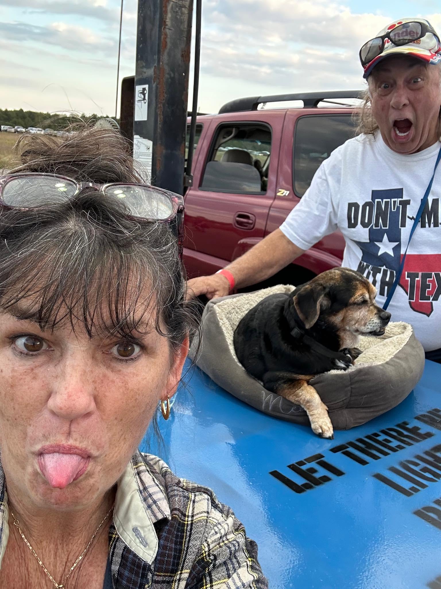 Mark, Eileen, and Capri traveling together on a road trip